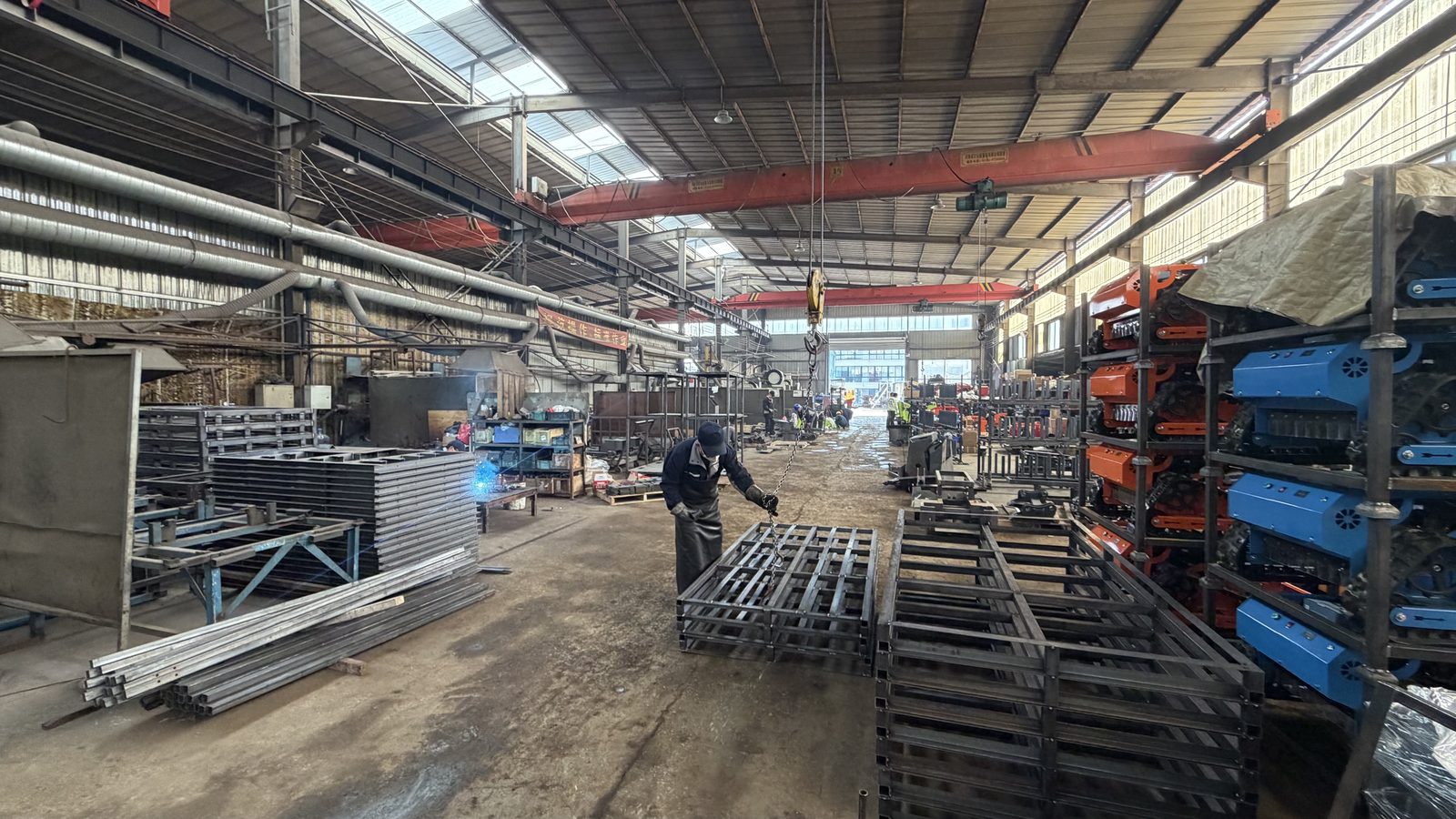 TorqMax factory interior — components and sub-assemblies staged for production